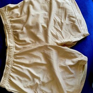 John Elliot gold colored practice shorts